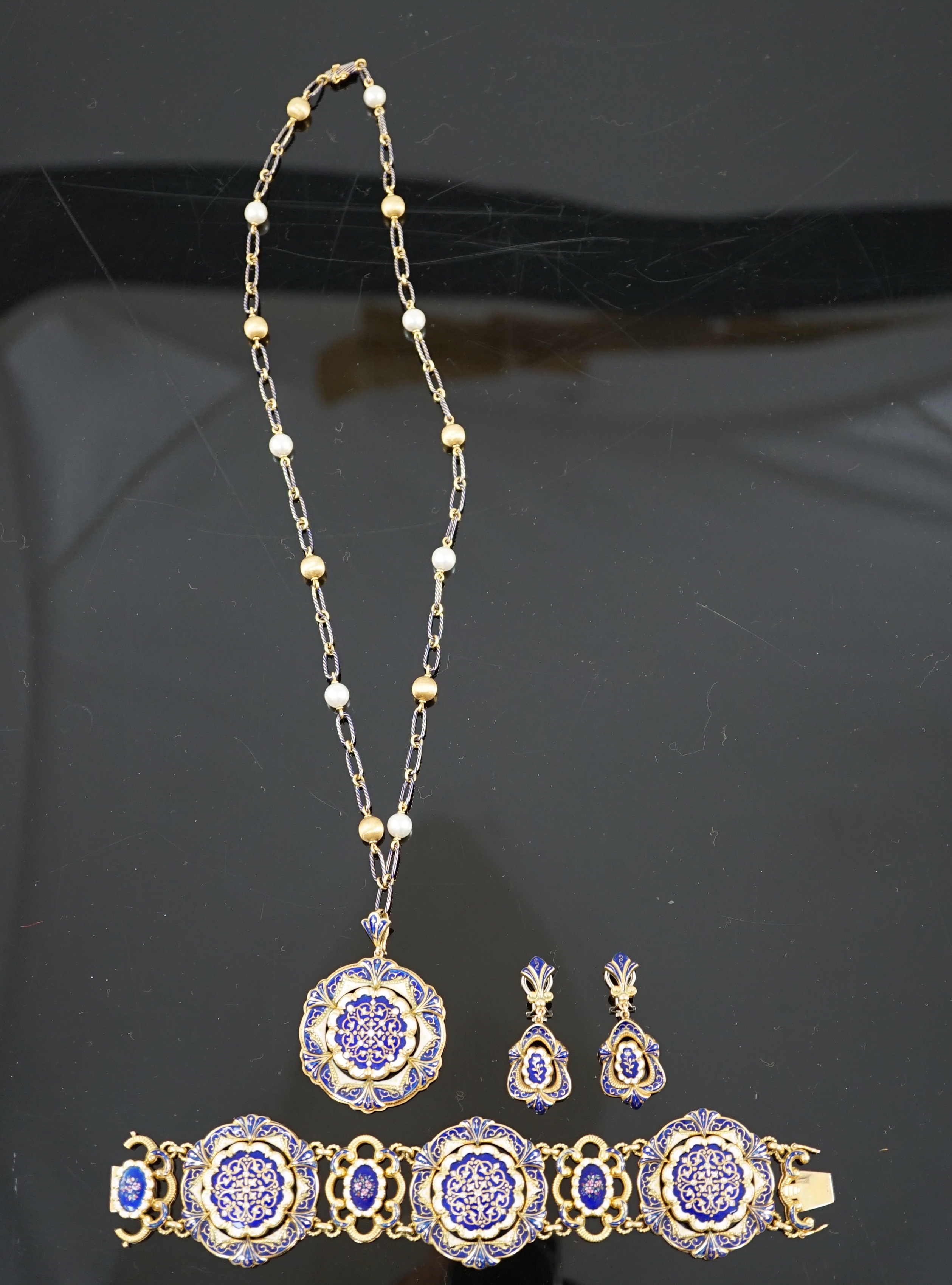 A mid 20th century Swiss 18ct gold and polychrome enamelled suite of jewellery, retailed by E. Meister, Zurich